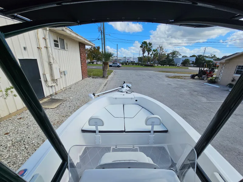 Slide: The Image of Clearwater 2000 boat, 2023 model, parked outdoors with a clear sky background. - 29