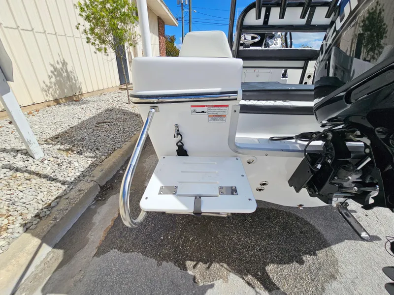 Slide: The Image of Clearwater 2000 boat, 2023 model, featuring a swim platform with a foldable ladder. - 31