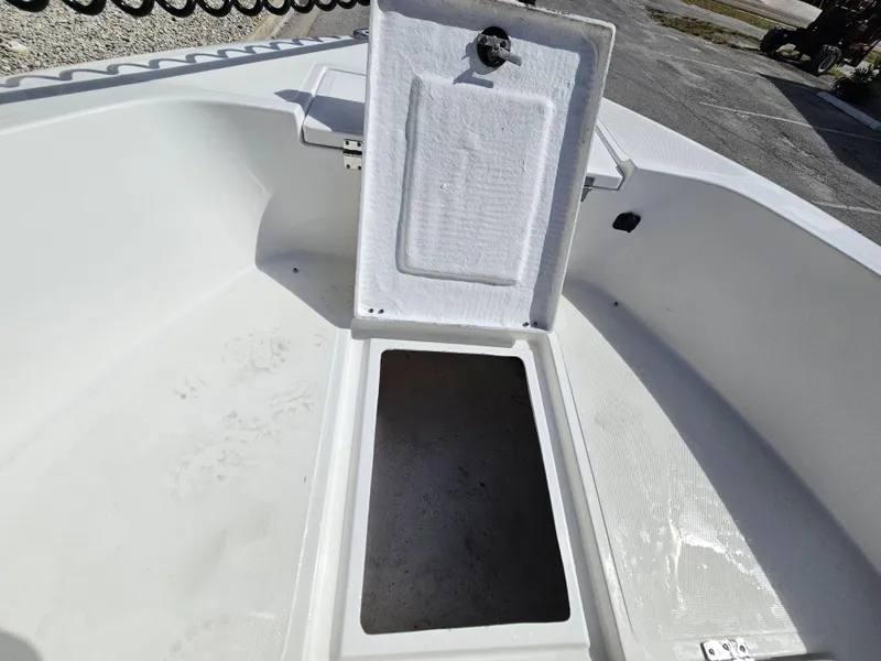 Slide: The Image of Open storage compartment on a 2023 Clearwater 2000 boat. - 36