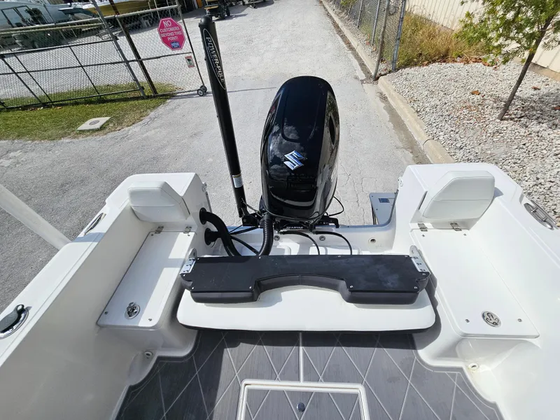 Slide: The Image of Clearwater 2000 boat, 2023 model, featuring a powerful outboard motor and spacious deck. - 4