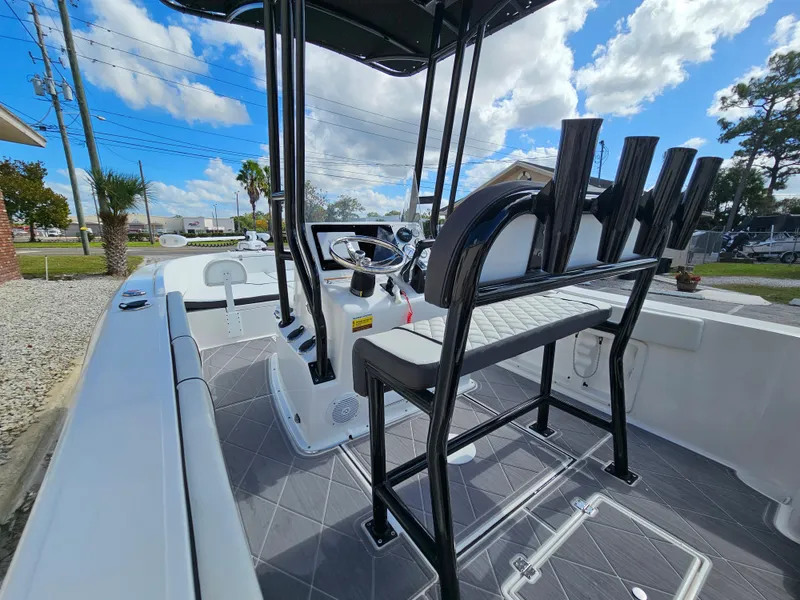 Slide: The Image of Clearwater 2000 boat 2023 model, interior view with seating and steering console. - 40