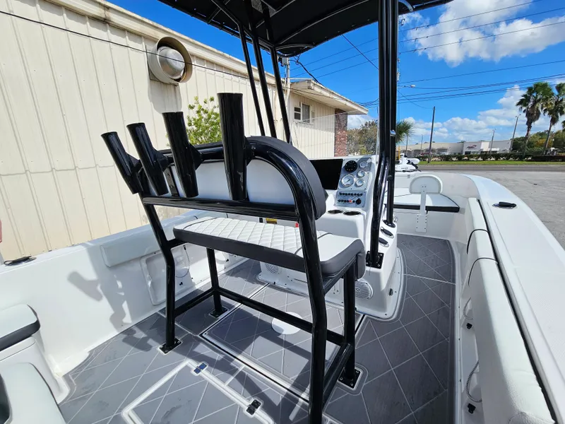 Slide: The Image of Clearwater 2000 boat 2023 model, interior view with seating and rod holders. - 41