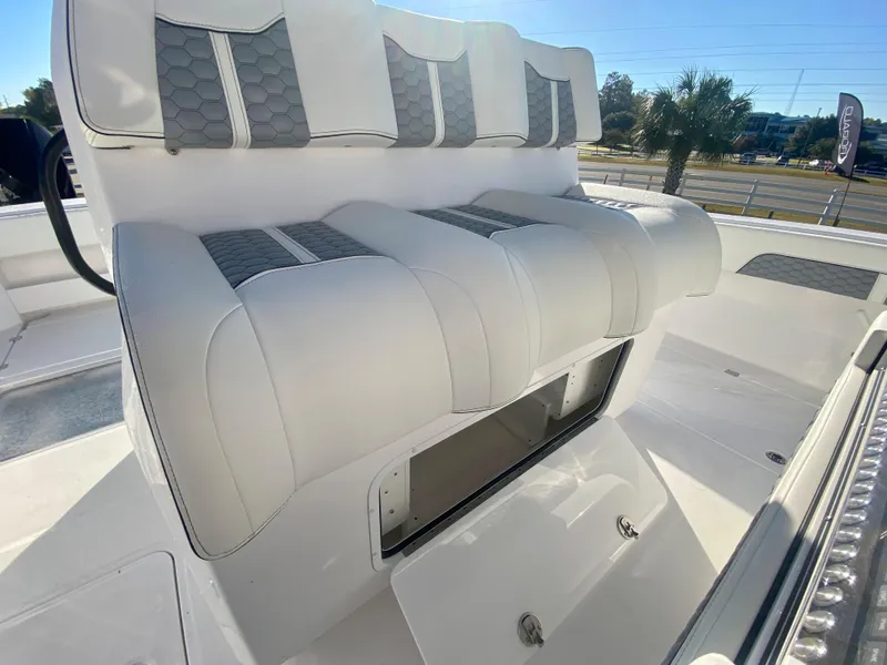 Slide: The Image of 2024 Invincible 35 Catamaran seating with storage compartment. - 17