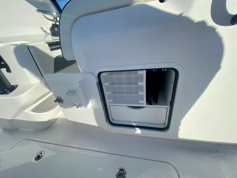 Slide: The Image of 2024 Invincible 35 Catamaran storage compartment with open door. - 14