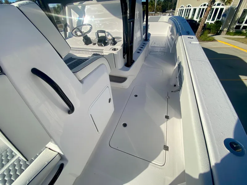 Slide: The Image of 2024 Invincible 35 Catamaran interior with seating and control console. - 15