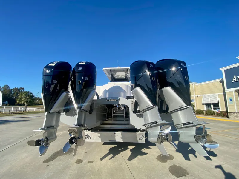 Slide: The Image of 2024 Invincible 35 Catamaran with quad outboard engines, rear view. - 5