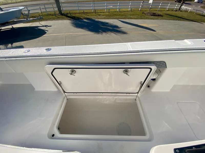 Slide: The Image of 2024 Invincible 35 Catamaran open storage compartment on deck. - 19