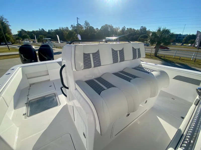 Slide: The Image of 2024 Invincible 35 Catamaran with white and gray seating, dual outboard motors. - 20