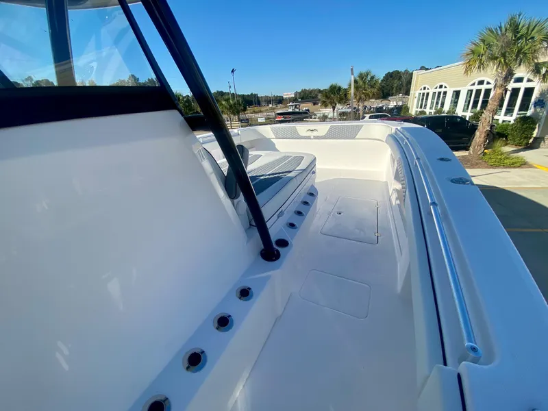 Slide: The Image of 2024 Invincible 35 Catamaran boat deck with seating and rod holders. - 21