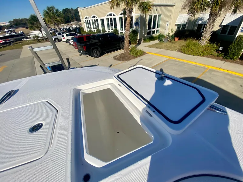 Slide: The Image of 2024 Invincible 35 Catamaran deck with open storage compartments. - 30