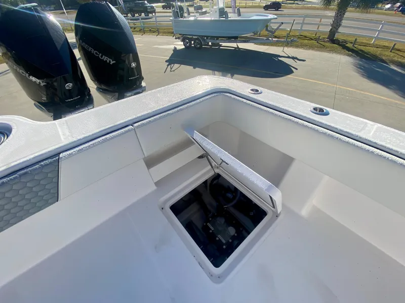 Slide: The Image of 2024 Invincible 35 Catamaran with open hatch and twin Mercury engines. - 9