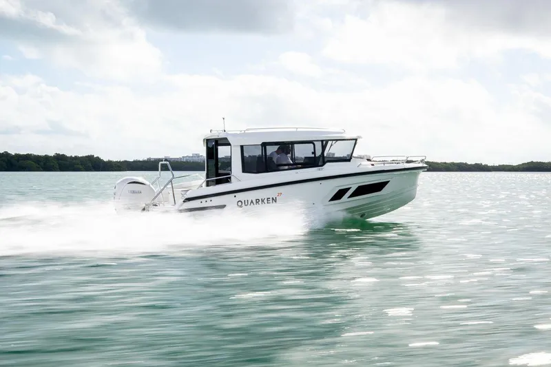 The Image of 2024 Quarken 27 Cabin boat cruising on water. - 1