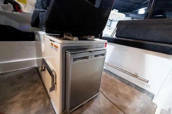 Slide: The Image of Interior of 2024 Quarken 27 Cabin boat showing seating and storage compartments. - 16
