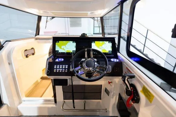 Slide: The Image of Interior helm of 2024 Quarken 27 Cabin with dual navigation screens. - 17