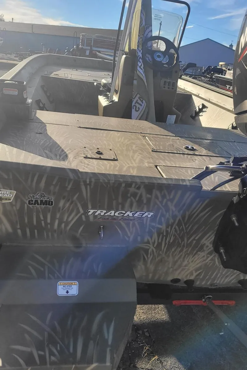 Slide: The Image of 2024 Tracker Grizzly 2072 CC boat with camouflage design. - 2