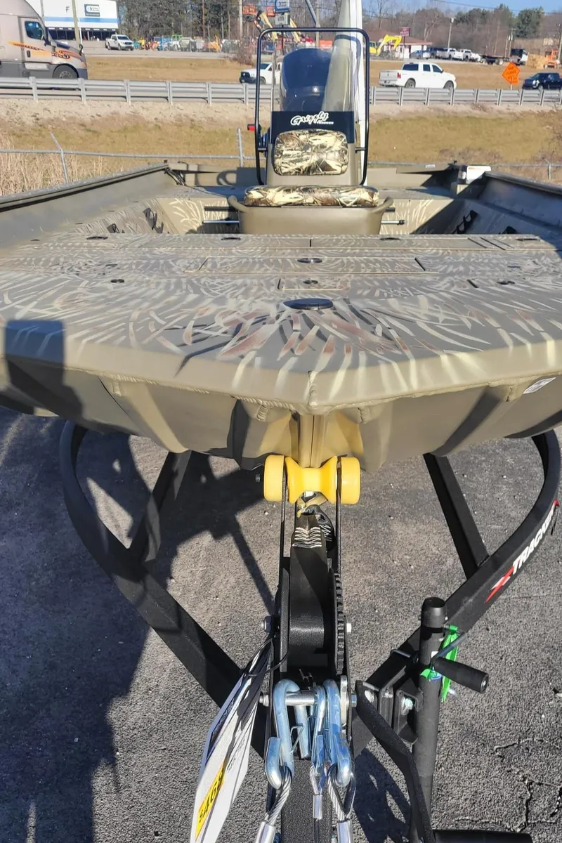 Slide: The Image of 2024 Tracker Grizzly 2072 CC boat on trailer, front view. - 3