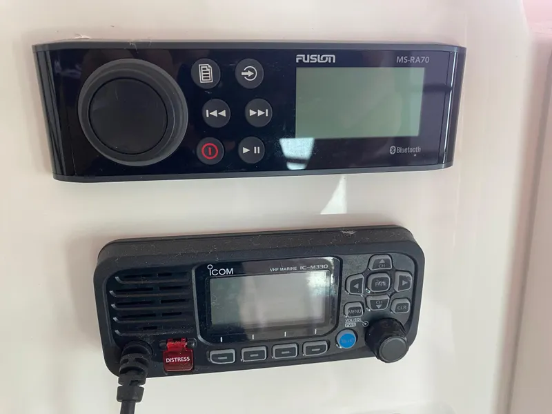 Slide: The Image of Fusion MS-RA70 and Icom IC-M330 radios on a 2019 Cobia 240 CC boat. - 11