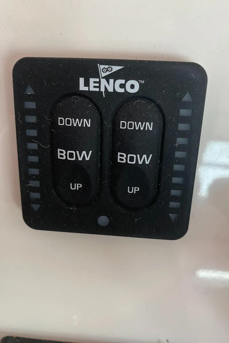 Slide: The Image of Lenco trim tab control panel on 2019 Cobia 240 CC boat. - 12