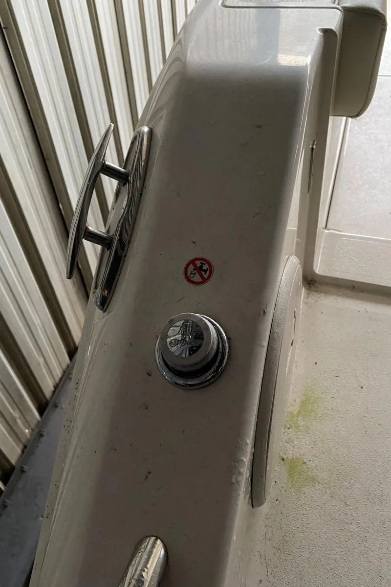 Slide: The Image of 2019 Cobia 240 CC boat deck with cleat and fuel cap. - 15