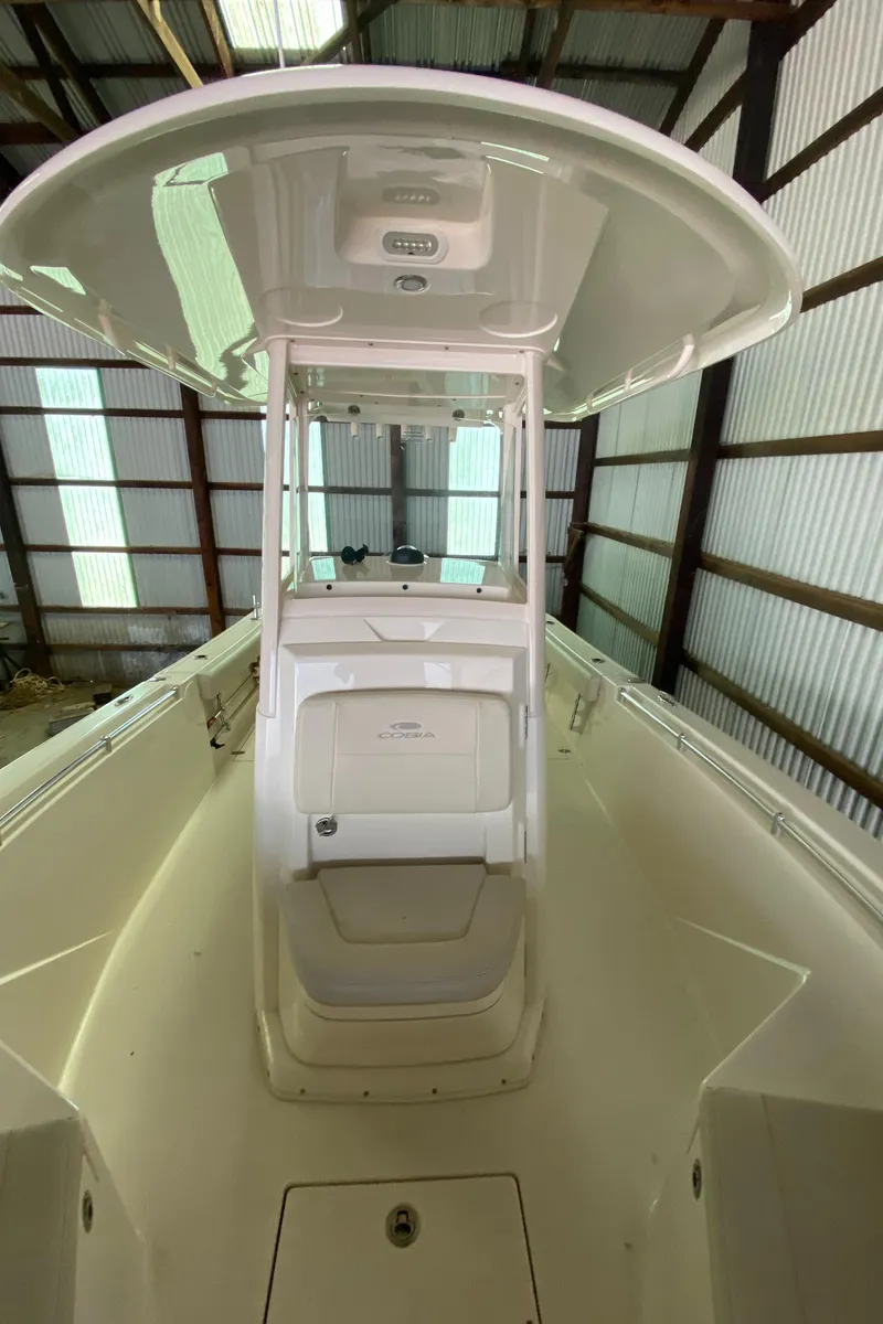 Slide: The Image of 2019 Cobia 240 CC center console boat in storage. - 18