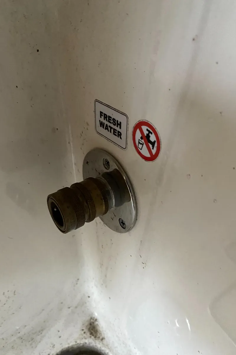 Slide: The Image of Fresh water inlet on a 2019 Cobia 240 CC boat. - 22