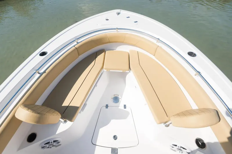 Slide: The Image of 2024 Sportsman Open 232 Center Console boat with tan seating in bow area. - 3