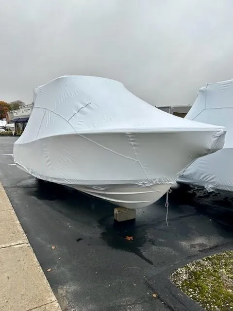 Slide: The Image of 2024 Sportsman Open 232 Center Console boat covered in protective wrap. - 8