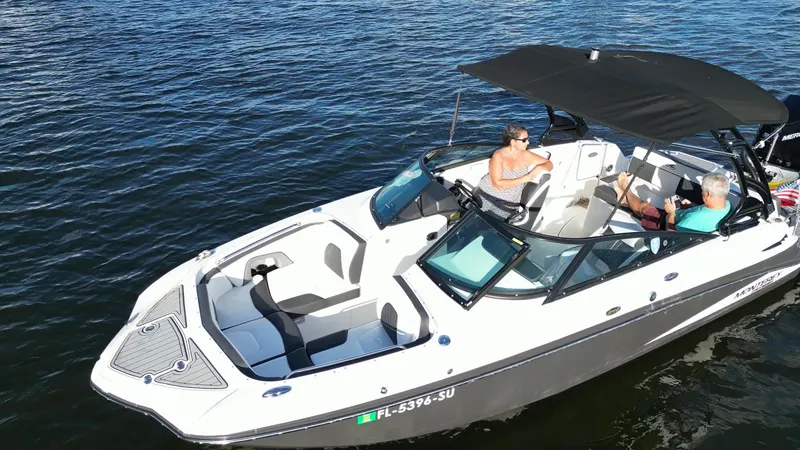 Slide: The Image of 2021 Monterey M-45 boat on water with two people onboard, enjoying a sunny day. - 14