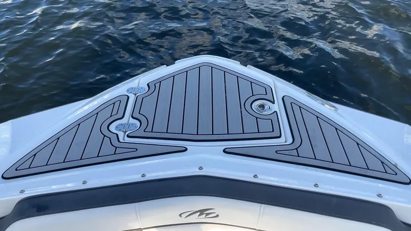 Slide: The Image of Bow of 2021 Monterey M-45 boat with sleek decking on water. - 16