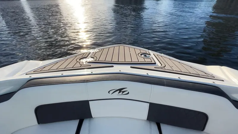 Slide: The Image of Bow view of 2021 Monterey M-45 boat on calm water at sunset. - 17
