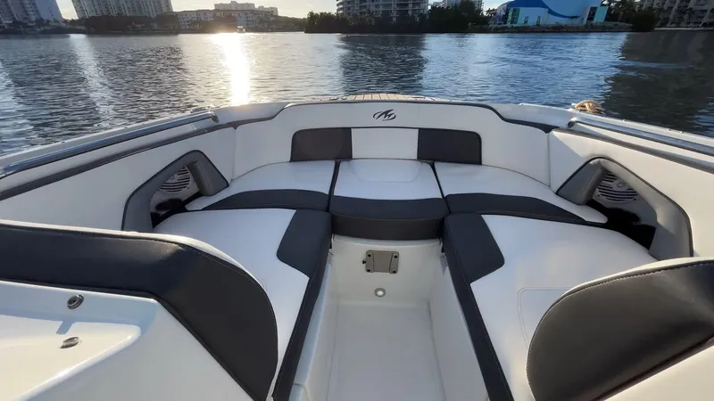 Slide: The Image of 2021 Monterey M-45 boat interior with sleek seating, overlooking a serene waterfront. - 19
