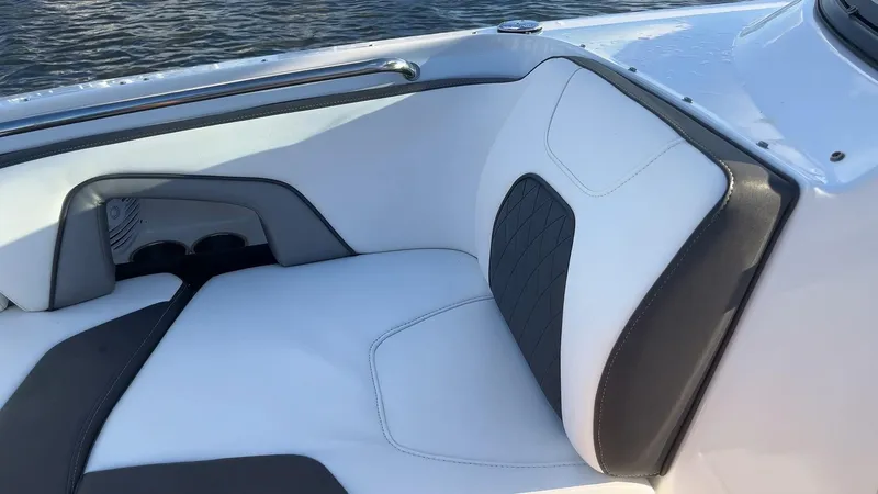 Slide: The Image of 2021 Monterey M-45 boat interior with white and black seating, near water. - 21