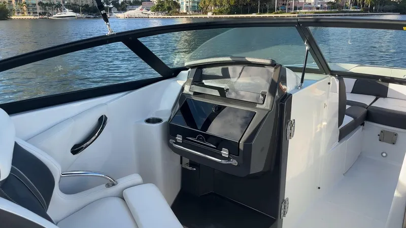 Slide: The Image of 2021 Monterey M-45 boat interior with sleek dashboard and comfortable seating by the water. - 28