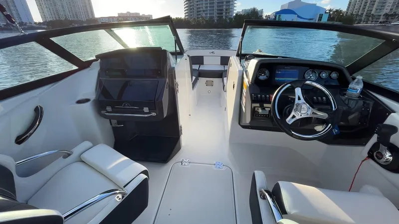 Slide: The Image of Interior of a 2021 Monterey M-45 boat with modern dashboard and seating. - 30