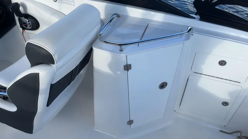 Slide: The Image of 2021 Monterey M-45 boat interior with white seating and storage compartments. - 37
