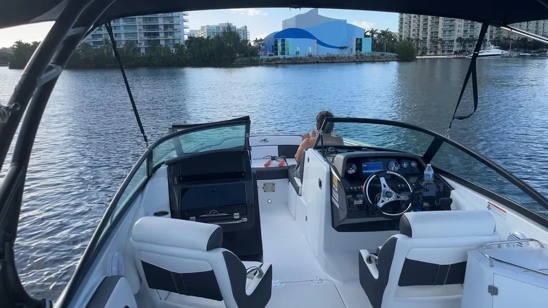 Slide: The Image of 2021 Monterey M-45 boat interior on a calm river with cityscape background. - 38
