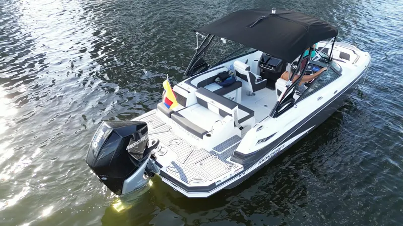 Slide: The Image of 2021 Monterey M-45 boat with canopy on water, rear view. - 4