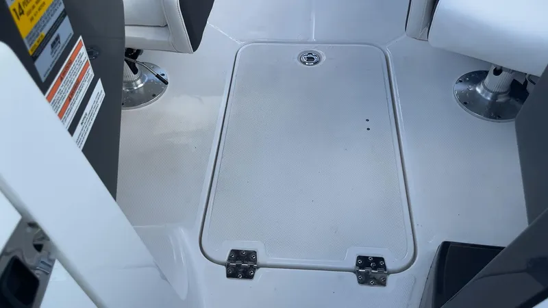 Slide: The Image of 2021 Monterey M-45 boat interior with storage hatch and seating. - 40
