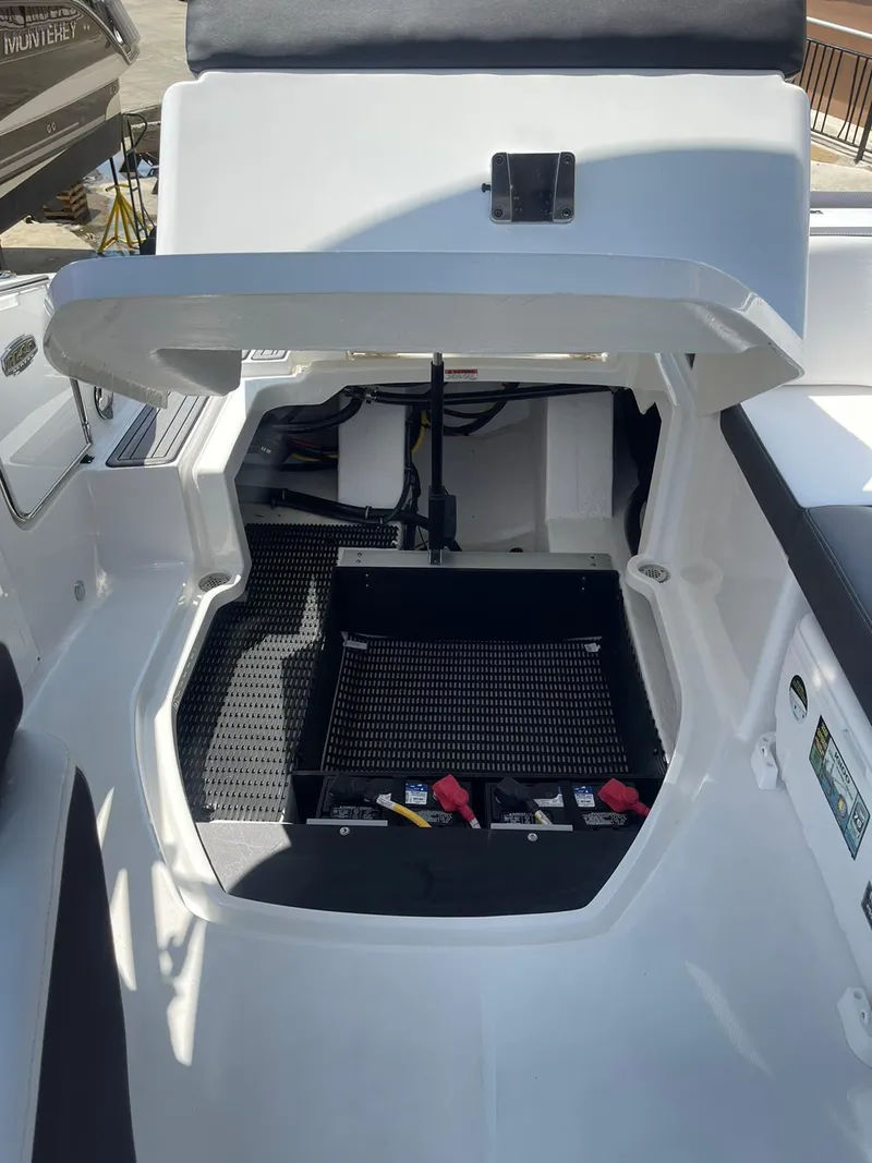 Slide: The Image of 2021 Monterey M-45 boat interior with open storage compartment and visible wiring. - 41