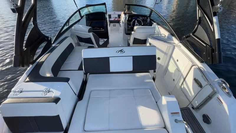 Slide: The Image of 2021 Monterey M-45 boat interior with white seating and sleek design on water. - 42