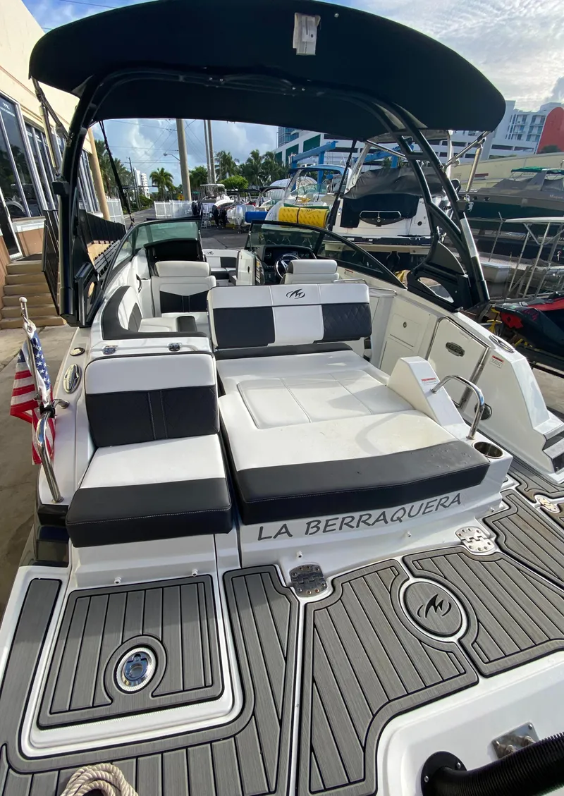 Slide: The Image of 2021 Monterey M-45 boat with sleek design and spacious seating, docked at marina. - 44