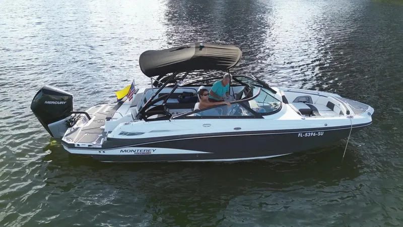 Slide: The Image of 2021 Monterey M-45 boat on water, featuring sleek design and spacious seating. - 6