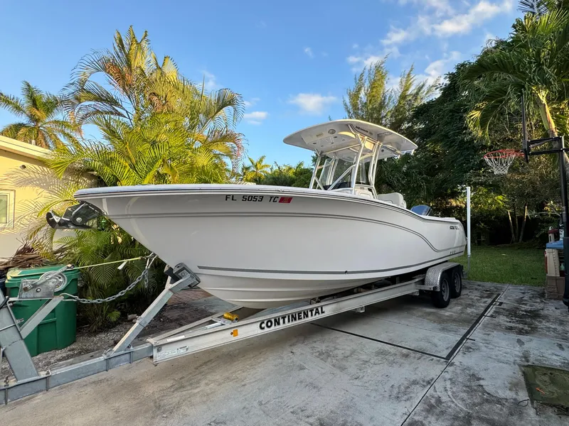 Slide: The Image of 2022 Sea Fox 248 Commander boat on a Continental trailer in a driveway. - 1