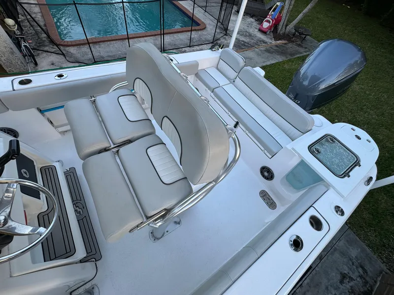 Slide: The Image of 2022 Sea Fox 248 Commander boat interior with seating and outboard motor. - 14