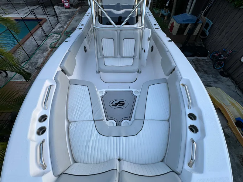 Slide: The Image of 2022 Sea Fox 248 Commander boat interior with white cushioned seating. - 16