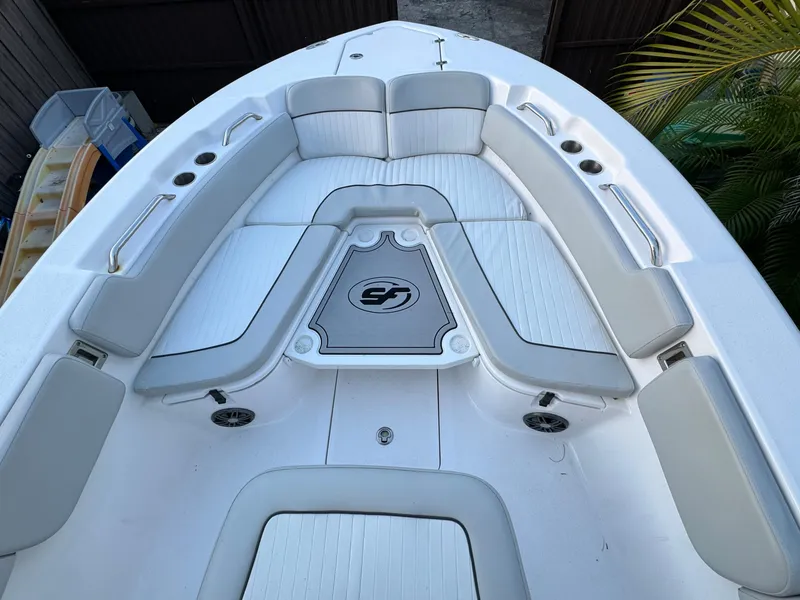 Slide: The Image of 2022 Sea Fox 248 Commander boat interior with cushioned seating and storage compartments. - 17