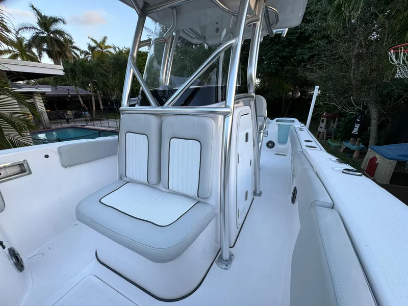 Slide: The Image of 2022 Sea Fox 248 Commander boat interior with cushioned seating and center console. - 19