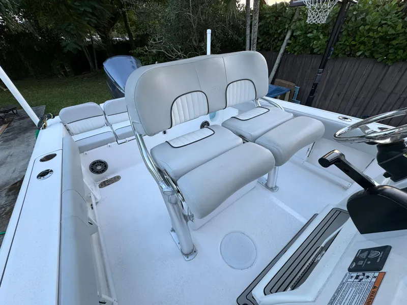 Slide: The Image of 2022 Sea Fox 248 Commander boat interior with dual captain's chairs and console. - 22