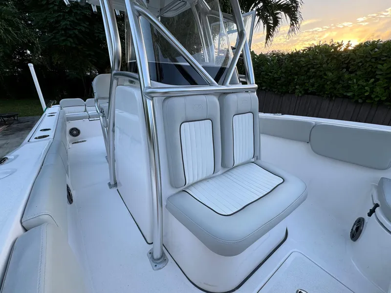Slide: The Image of 2022 Sea Fox 248 Commander boat interior with cushioned seating and stainless steel frame. - 24