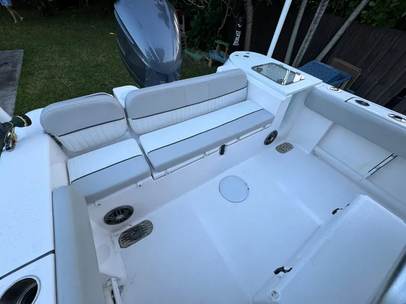 Slide: The Image of 2022 Sea Fox 248 Commander boat interior with white seating and spacious deck. - 25